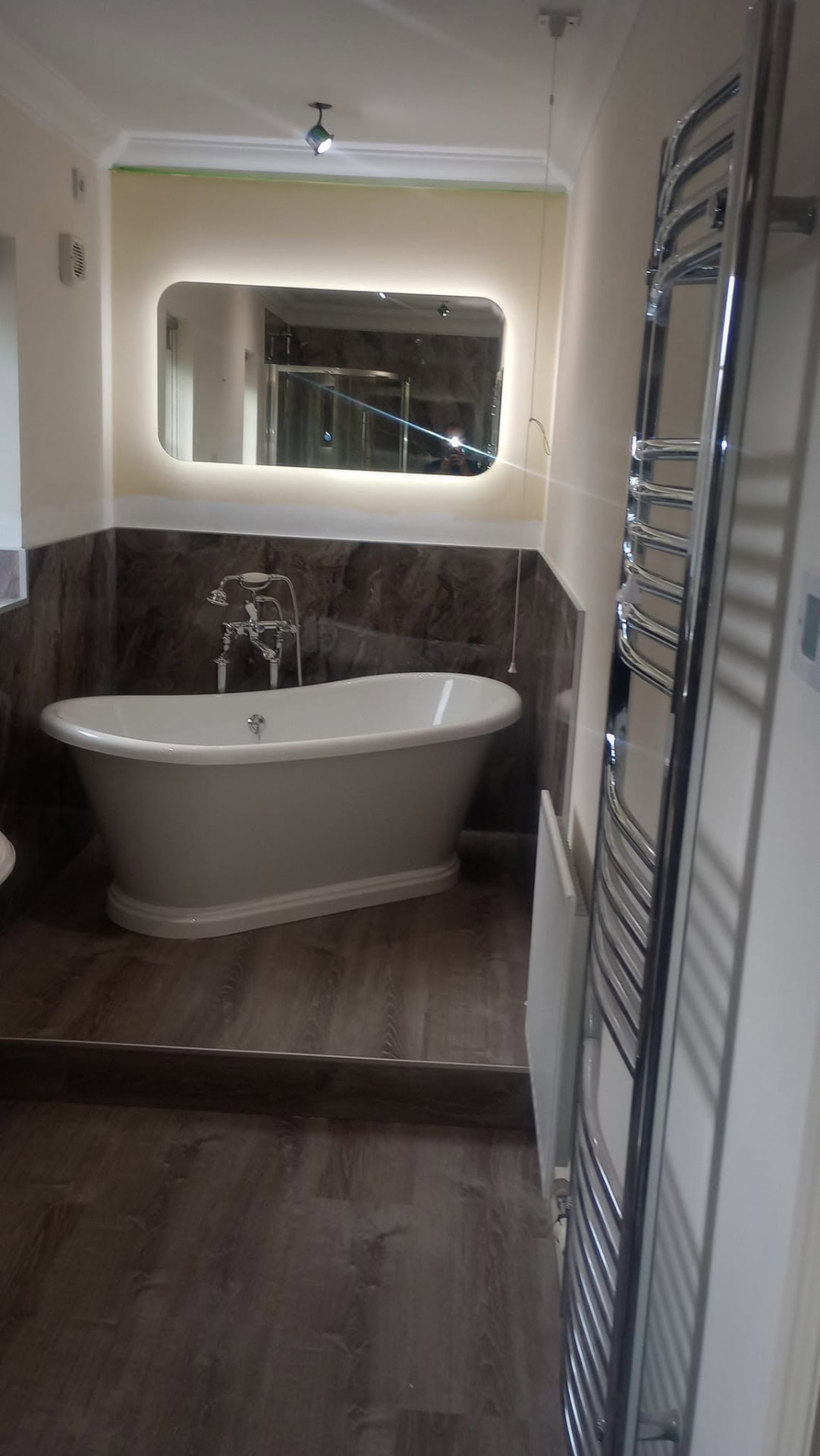 Traditional freestanding bath in a completed bathroom